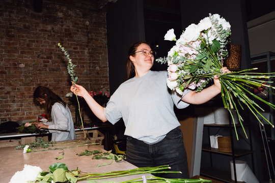 Florist holding a fresh flower bouquet