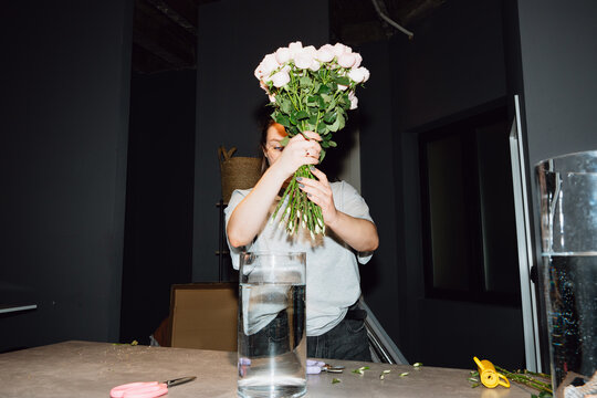 Florist Holding a Pink Rose Bouquet
