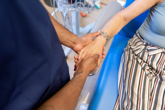 Doctor holding patient hand offering support and comfort