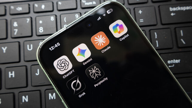 Smartphone screen displaying various artificial intelligence mobile applications including chatgpt gemini claude grok and perplexity.