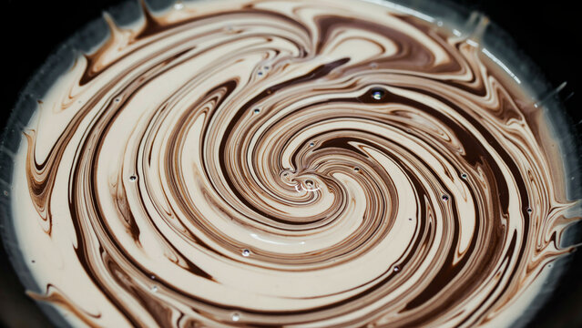 Glossy caramel chocolate swirl texture, high-angle macro shot