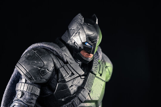 DC Batman armored superhero action figure standing side position with lowered head
