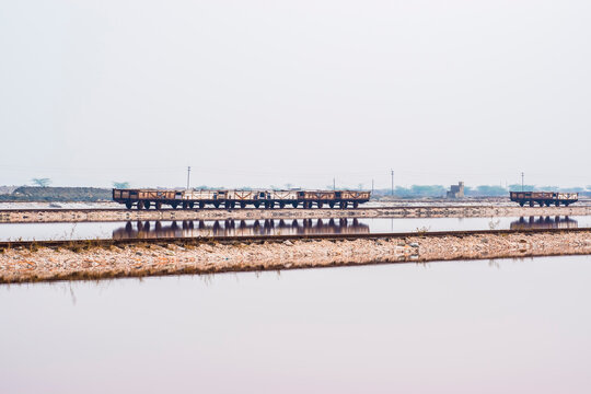 Goods Train or Freight Train also called as Maal Gaadi at the railway track through the middle of Sambhar Salt Lake, Rajasthan