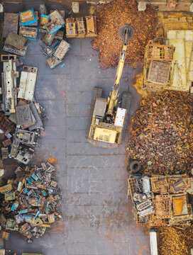 Electromagnetic Crane Sorting Metal at Recycling Yard
