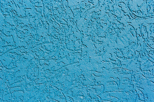 Textured Blue Surface with Abstract Patterns and Depth