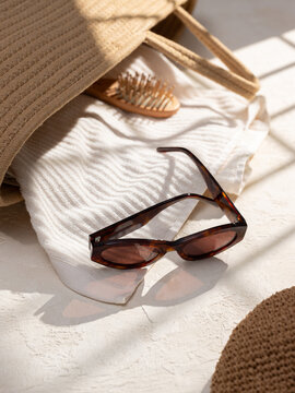 Beach Bag Essentials on texture background