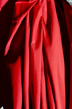 Draped Red Fabric with Intricate Textures