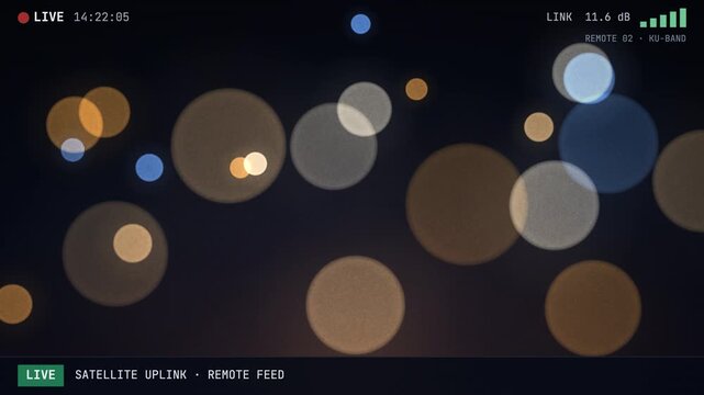 Live satellite uplink broadcast interface with signal status and bokeh background.