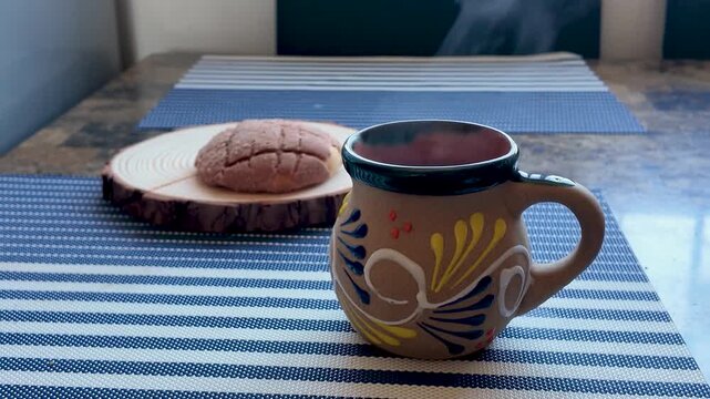Preparing a traditional mexican breakfast with coffee and concha sweet bread