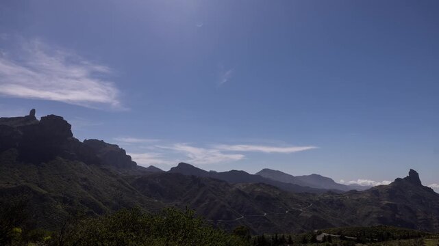 a timelapse of the roque nublo in gran canaria with slow passing clouds