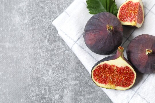 Ripe sweet figs on grey background. Healthy mediterranean fig fruit