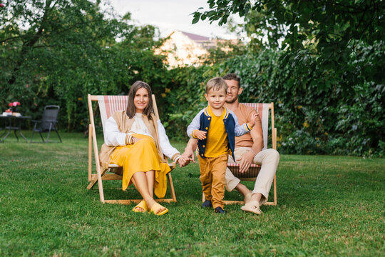 Happy Pregnant Mother With Husband And Son