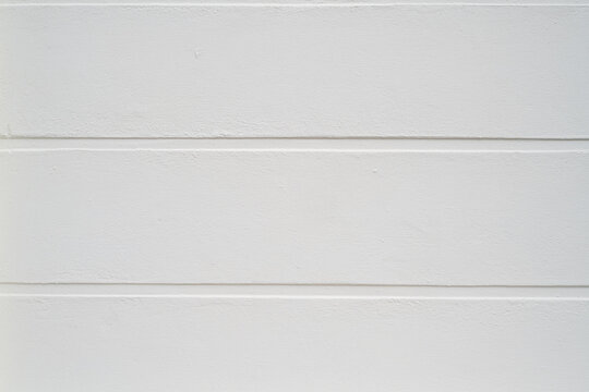White painted cement wall texture with horizontal lines and subtle rough surface