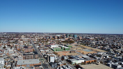 Fototapeta premium Aerial panorama of Baltimore city with new construction sites and downtown skyline in the distance