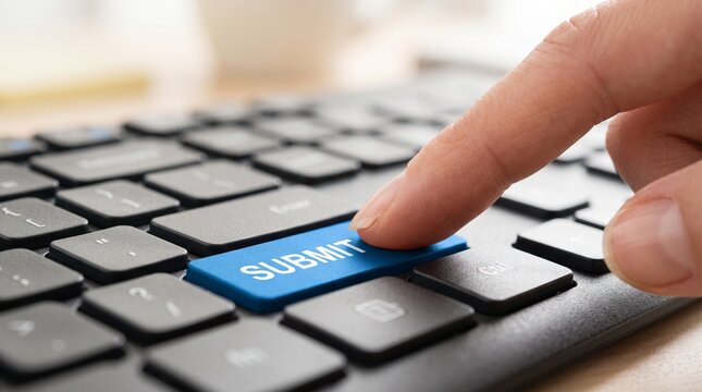Finger press blue submit key on computer keyboard for online form submission