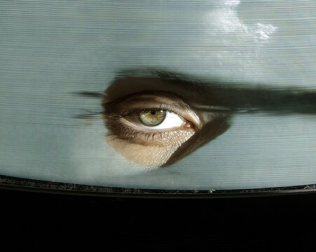 Close up of a human eye on a glowing vintage crt monitor, featuring soft phosphor bloom and scan lines for retro tech and media history