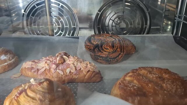 Assorted baked goods with golden crust and textured surface, artisanal food display, culinary product detail.