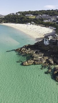 Vertica through the charming narrow cobblestone streets and traditional white houses of the historic seaside town of St Ives.