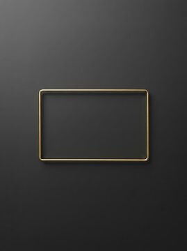 A simple rectangular frame with a thin green border on a dark gray textured background surface