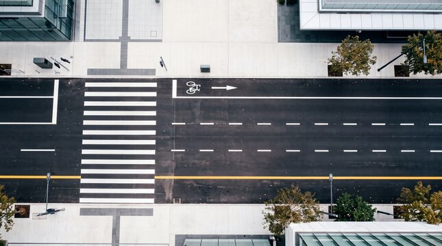 Aerial Overhead View of Empty City Street with Crosswalk and Bike Lane