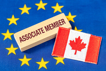 Canada as an associate member of the European Union. Business concept. EU flag, a symbol of Canada,...