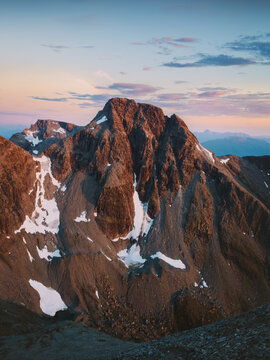 Rocky peak in Lyngen Alps northern Norway midnight sun season mountain landscape at sunset, summer season Scandinavian scenery outdoor travel beautiful destination Nordic wilderness