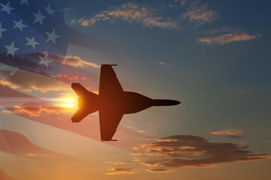 Air Force Day. Aircraft silhouette on background of sunset with a transparent American flag.