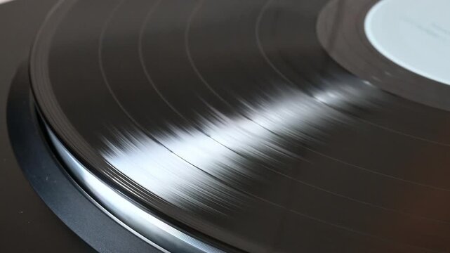 Close up of a vinyl record spinning on a turntable