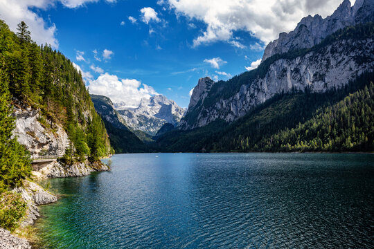 Majestic Vorderer Gosausee Lake Surrounded by Austrian Alps Forested Mountains and Dramatic Sky