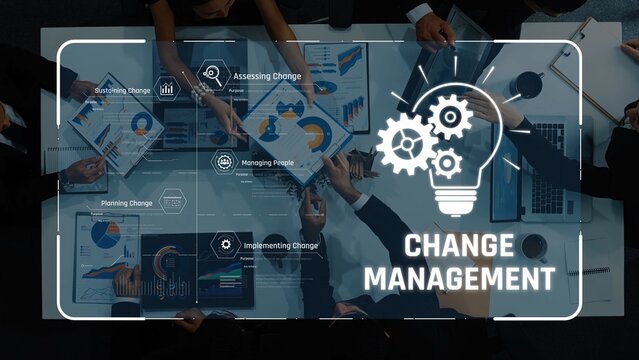 Group of professionals engaged in change management discussion, analyzing graphs and charts to enhance business strategies and improve organizational productivity. Raster