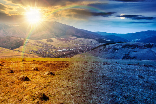 mountainous rural landscape of ukraine on spring equinox. picturesque highland under epic sky. grassy meadow at twilight. carpathian countryside scenery with forest on a hill behind the pasture