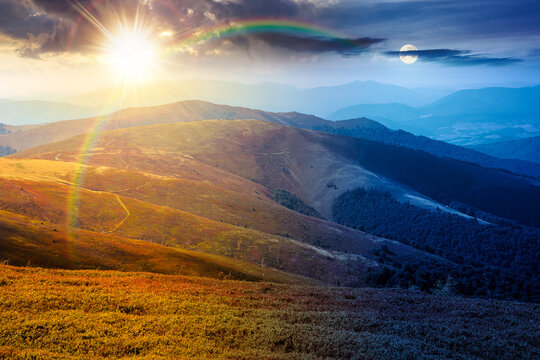 Carpathian mountain landscape in late summer. day meet night. sun and moon over scenic view of Transcarpathia region from the Great Summit. colorful alpine blueberry field on Polonyna Play hill
