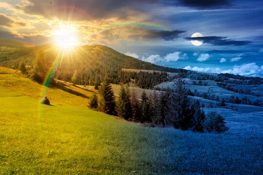rural fields on autumn equinox. day meet night. sun and moon over trees on the grassy hills at twilight. beautiful countryside scenery of carpathian mountains. clouds on the epic sky