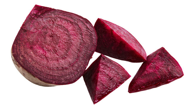 Isolated raw fresh red beetroot slices and chunks, vibrant healthy root vegetable, organic food