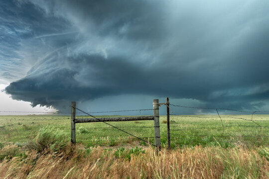 Storm cell formation in Tornado Alley over farmland
