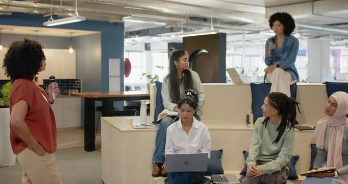 Diverse women taking turns talking after left host starting with mics and laptop in office meeting