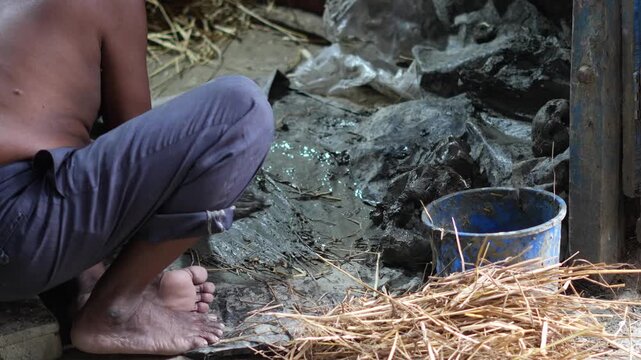 Kumartuli Artisan Working with Clay During the Creation of Traditional Festival Murtis in Kolkata