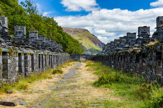 Ruined stone cottages of Anglesey Barracks at abandoned Dinorwic slate quarry near Llanberis, Wales