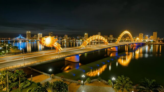 cinematic aerial view of dragon bridge in da nang vietnam illuminated after sunset timelapse video