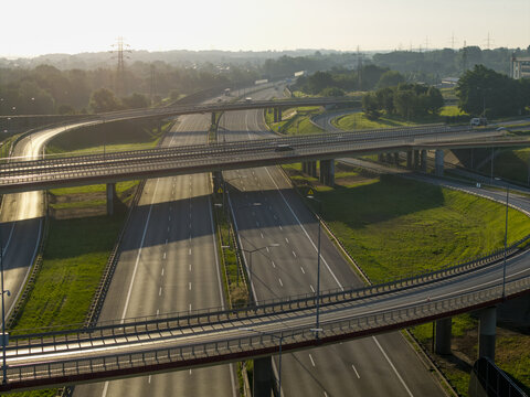 Aerial view of multilayer highway interchange at sunrise