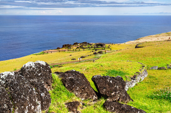 Historical stone ruins of Orongo ceremonial village overlooking the Pacific Ocean on Easter Island, Chile.