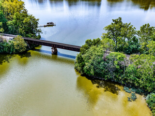 A railroad trestle across Morse Lake in Cicero, Indiana. © Greg