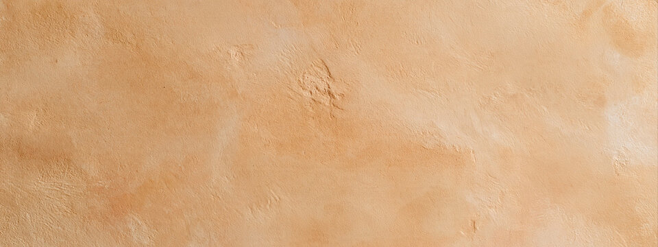 Beige plaster wall texture banner. Mottled terracotta stucco background