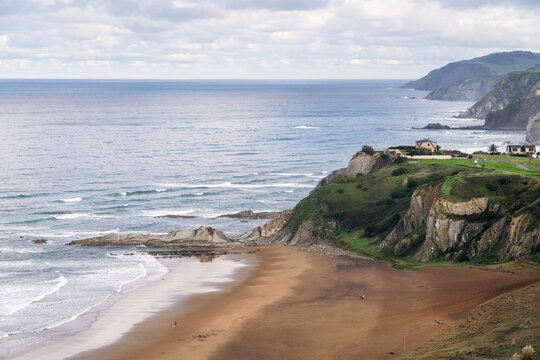 Scenic aerial view of dramatic coastal cliffs and sandy beach in Sopelana, Basque Country, Northern Spain