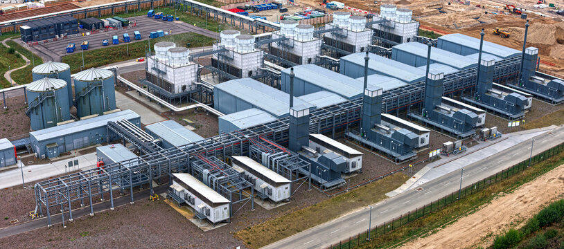 Taulov, Denmark - 28 August 2026: Aerial view of Google Data Center Fredericia, showing backup power units, cooling water treatment, and heat exchange units with the extension site.