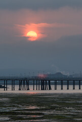 Obraz premium Sunset over Calatrava Pier and industrial waterfront in Santander Bay, Spain
