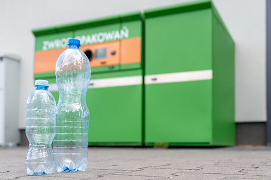 Beverage bottles in front of a packaging return station.