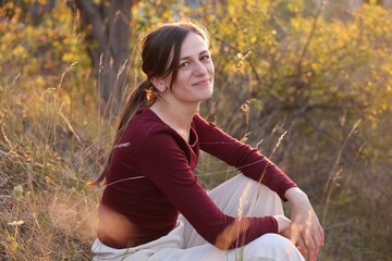 Portrait of beautiful woman outdoors on sunny day