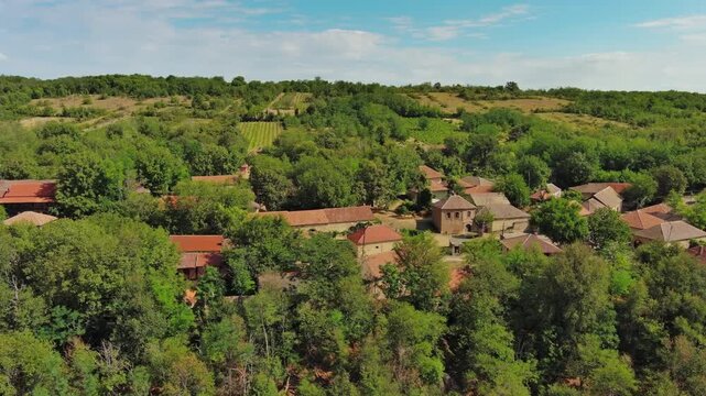 Aerial around view of old rustic vintage houses with wine cellars in Rogljevacke pivnice in Negotin region of Serbia, 4k