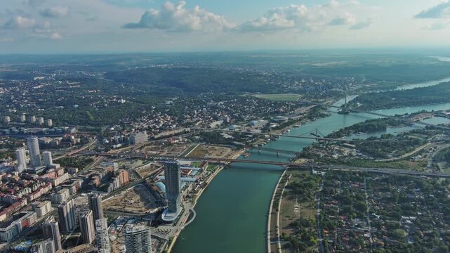 Aerial view of Belgrade at confluence of Sava and Danube rivers. Urban landscape, forested river island and city view, 4k